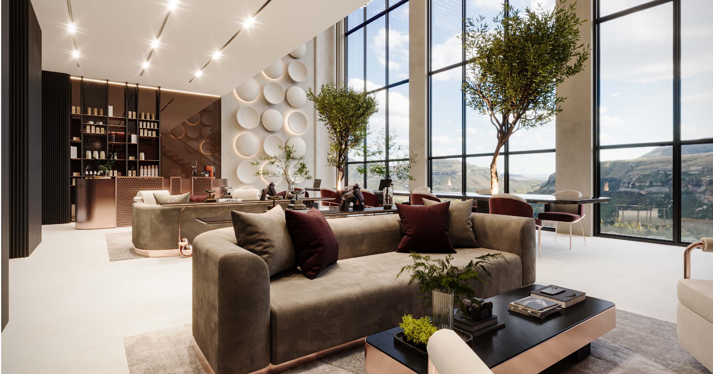 Luxor By Imtiaz Modern lounge area with elegant furniture, large windows, and greenery, offering a scenic view of mountains.
